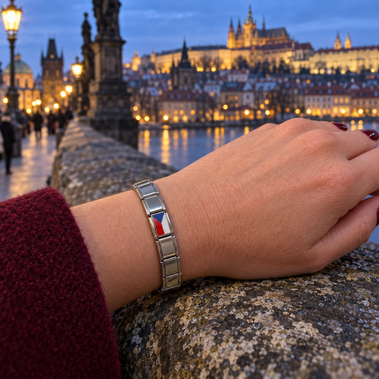 Czechia flag Italian charm on a polished silver bracelet overlooking Prague at blue hour