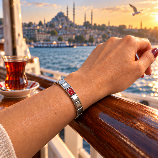 Turkey flag Italian charm on a silver charm bracelet aboard an Istanbul ferry overlooking the Bosphorus