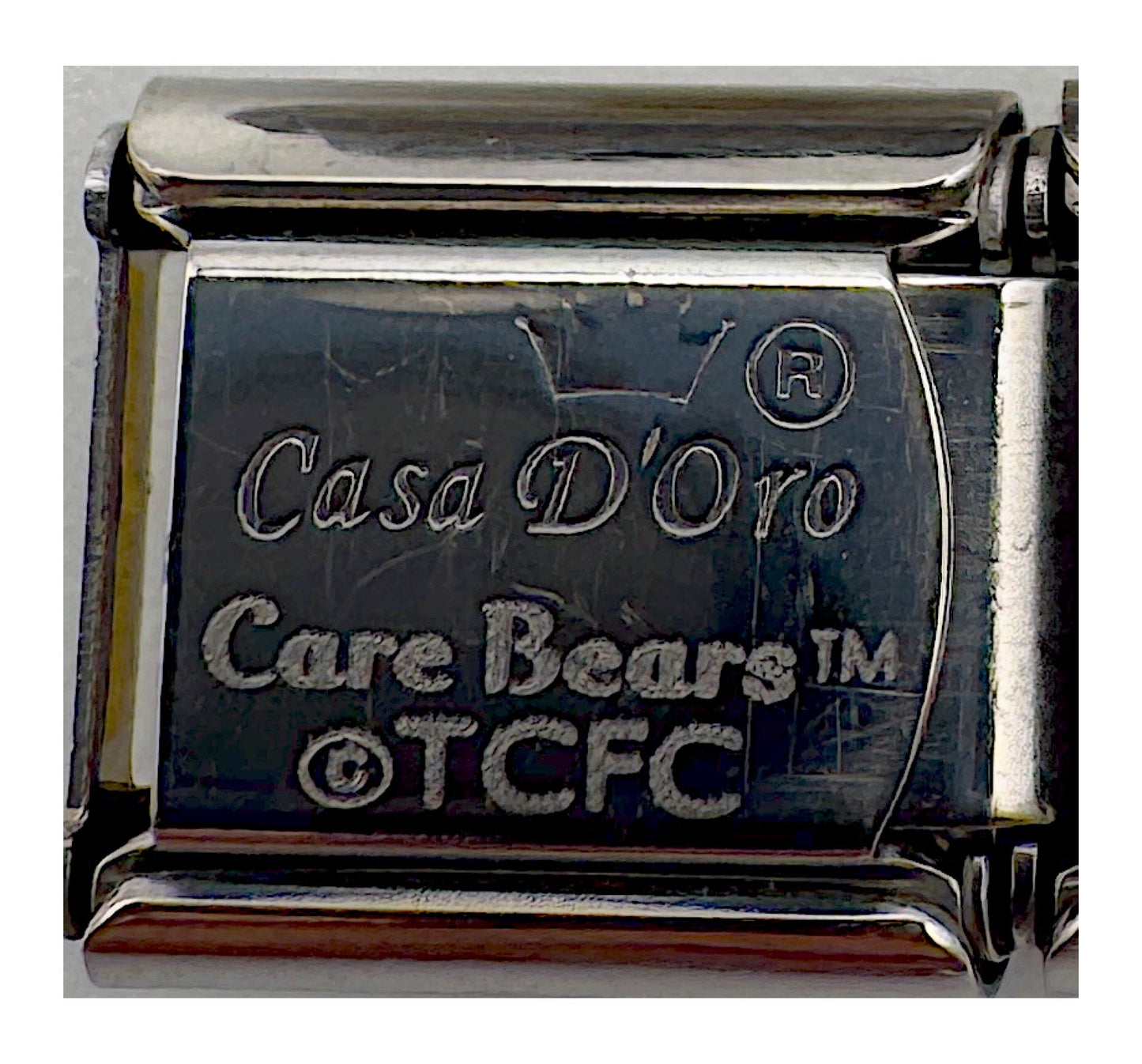 Backstamp for Vintage Casa d'Oro Care Bears Bedtime Bear Italian Charm (Those Characters From Cleveland / TCFC mark)