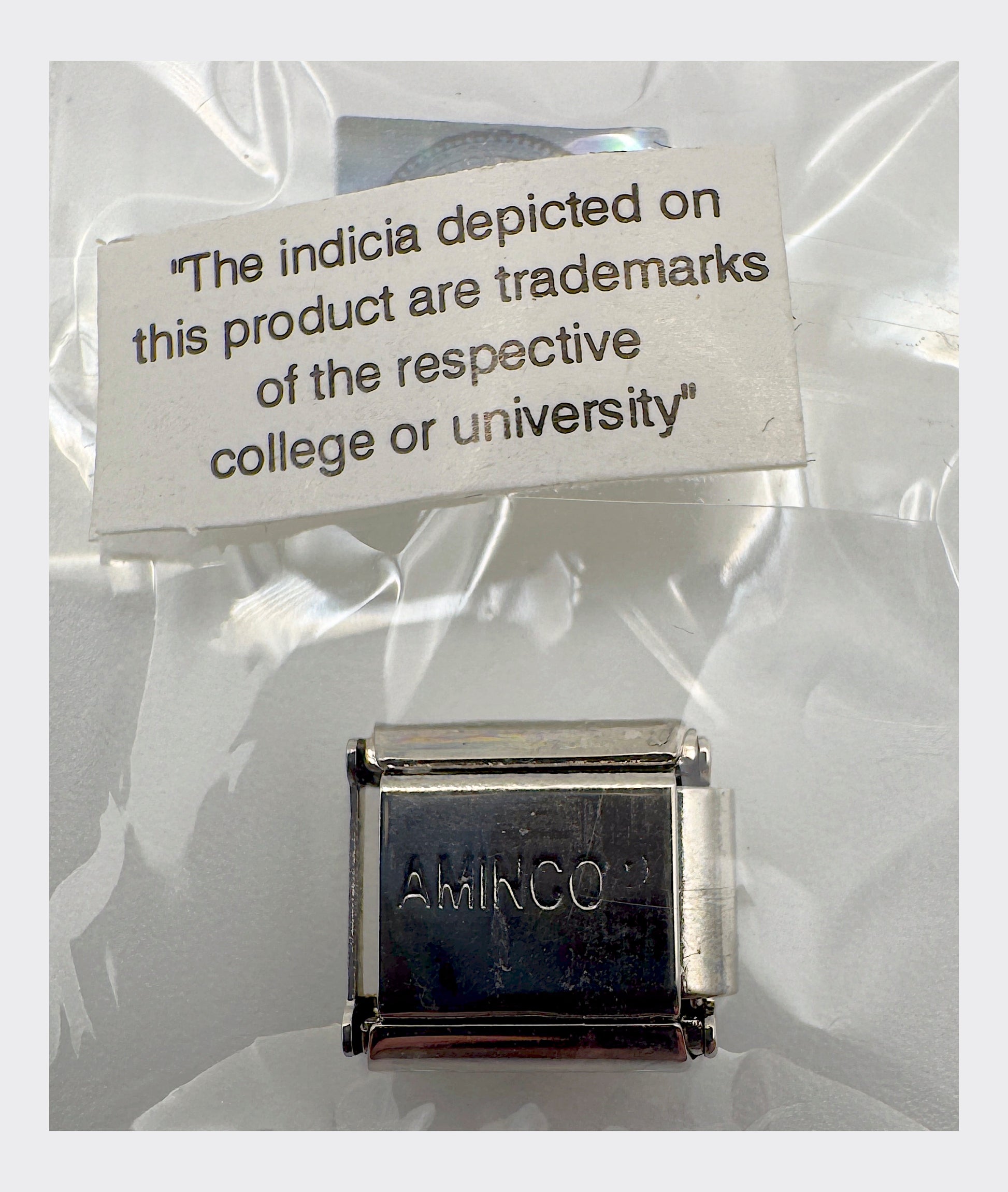AMINCO maker's mark backstamp with collegiate trademark licensing disclaimer