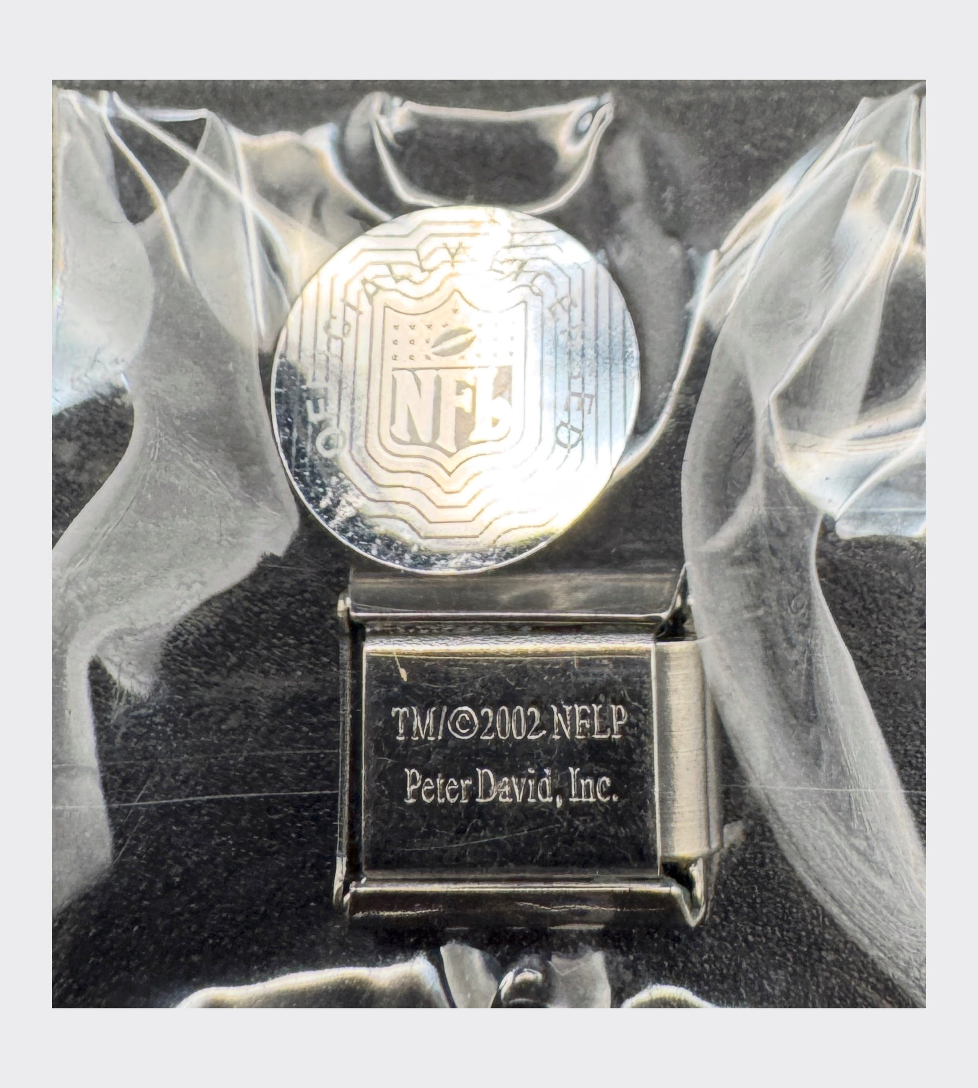 Backstamp reading TM 2002 NFLP, Peter David Inc, confirming official NFL license