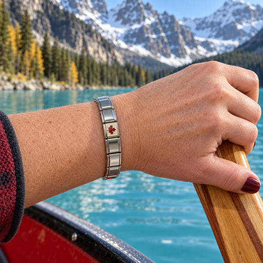 Canada maple leaf Italian charm on a polished silver bracelet while canoeing on Moraine Lake
