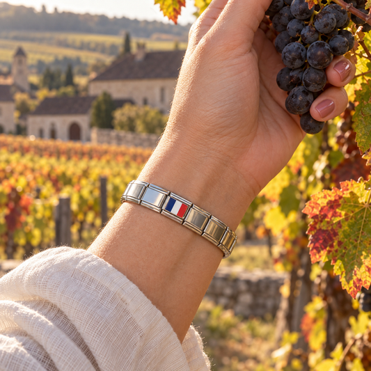 France flag Italian charm on a polished silver base bracelet in an autumn Burgundy vineyard
