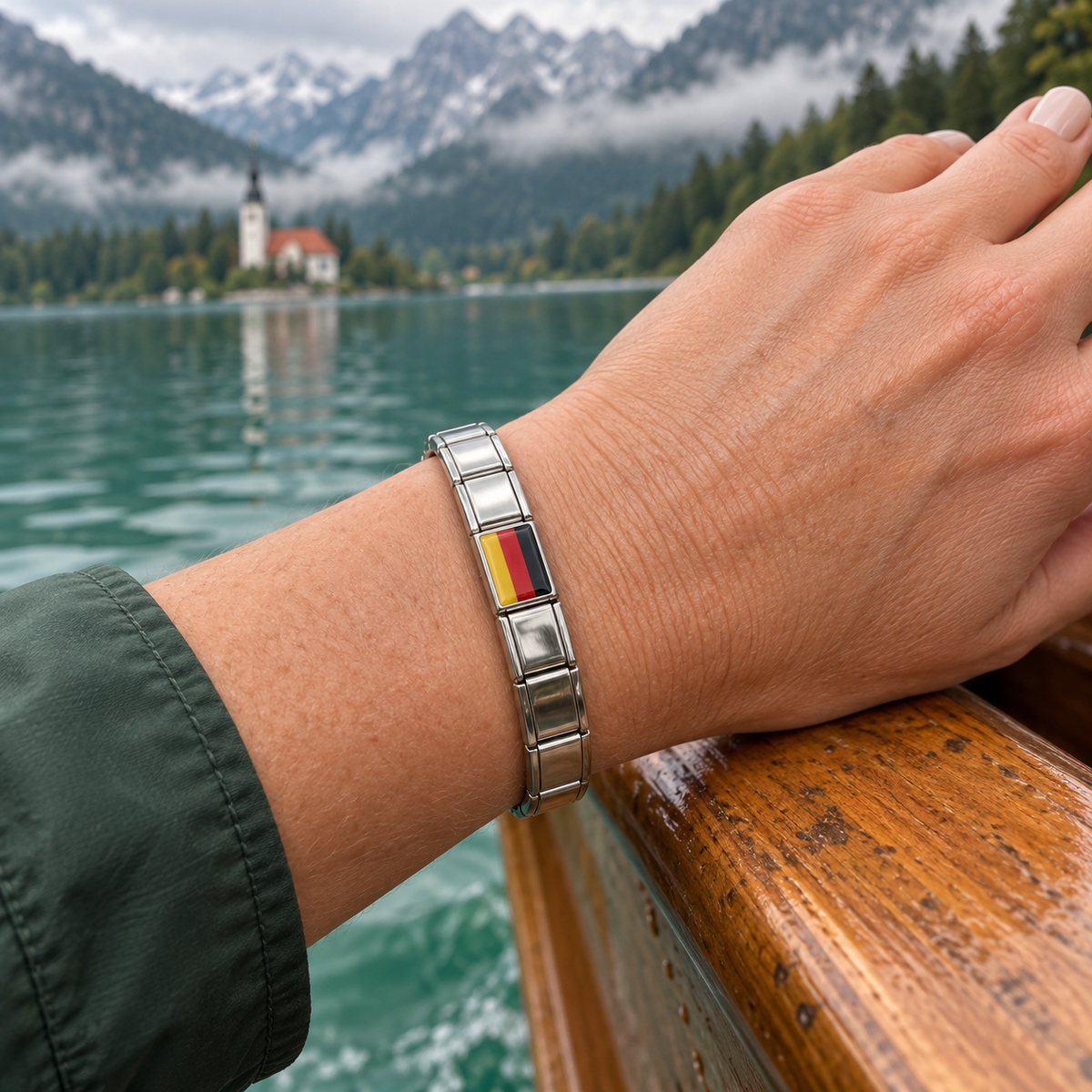German flag Italian charm on a silver 9mm italian bracelet worn beside a Bavarian alpine lake