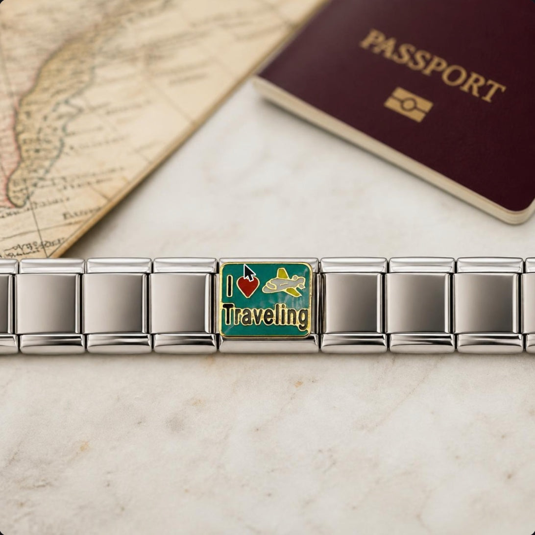 I Heart Traveling Italian charm on bracelet, flat lay with travel props