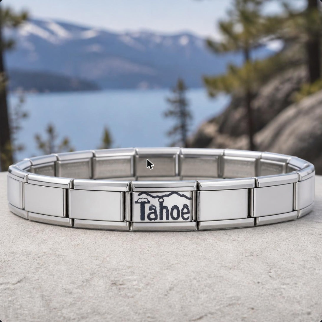 Lake Tahoe Italian charm on bracelet, flat lay with lake and mountain scenery