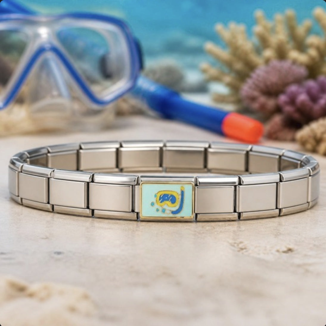Snorkel Italian charm on bracelet, flat lay